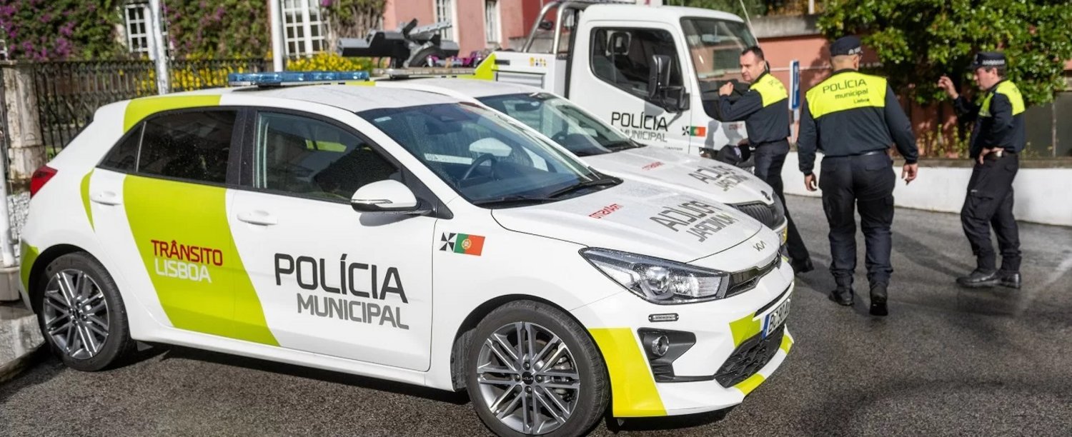 cars and members of the Municipal Police on the street