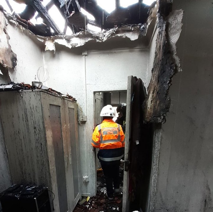 person is inside a house in ashes